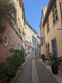 Street amidst buildings against sky