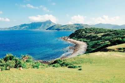 Scenic view of sea against cloudy sky