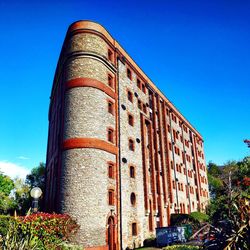 Low angle view of building against blue sky