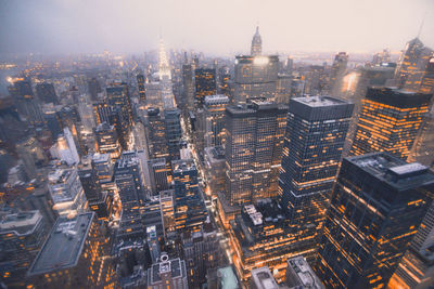 High angle view of illuminated buildings in city