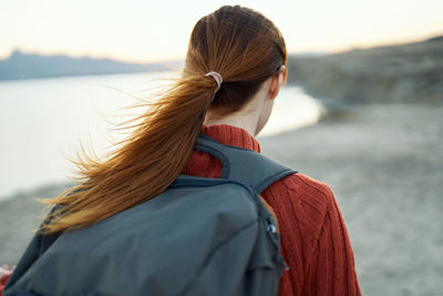 Rear view of woman looking at sea