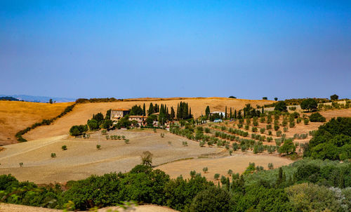 Panoramic view of landscape against clear blue sky