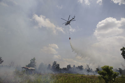 Low angle view of airshow against sky