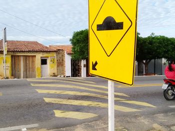 Road sign on street in city