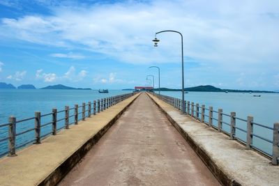 Pier in sea against sky