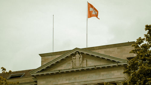 Low angle view of flag against building