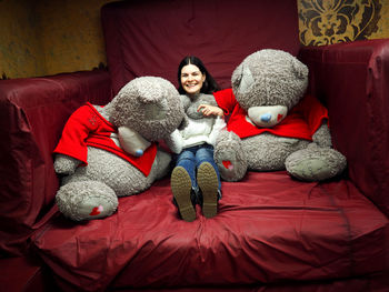 Portrait of young woman on sofa