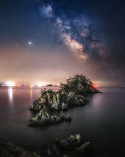 Scenic view of sea against sky at night