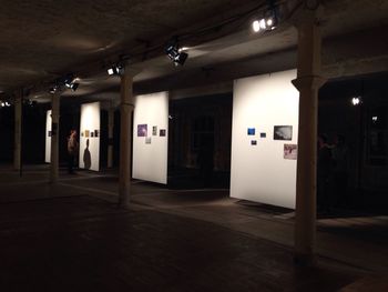 Empty corridor of illuminated building