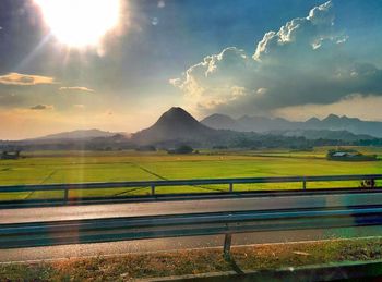 Scenic view of landscape against cloudy sky