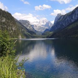 Scenic view of lake and mountains against sky