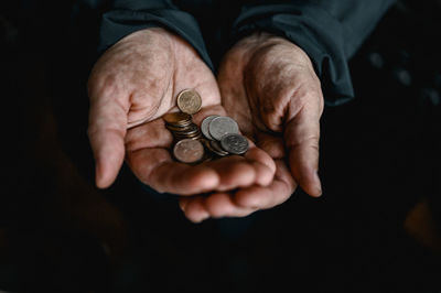 Hands holding coins 