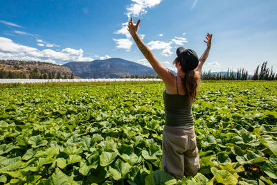 Full length of woman standing on field