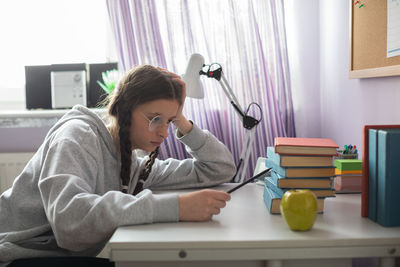 Student heartbroken at how many more books she will have to read.