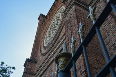 Low angle view of old building against clear sky