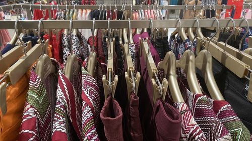 Group of people at market stall