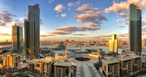 Cityscape against sky during sunset