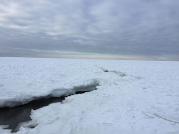 Scenic view of sea against sky during winter