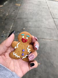 Midsection of person holding cookies