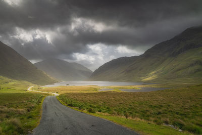 Road leading trough doolough valley with lakes, between mountain ranges, ireland