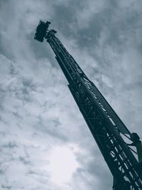 Low angle view of crane against sky