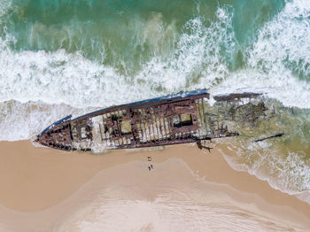Aerial view of shipwreck at beach