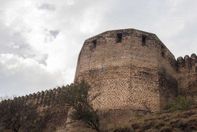 Low angle view of fort against sky