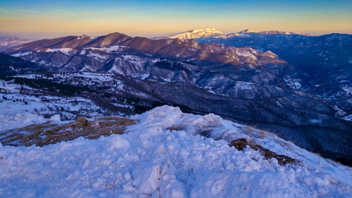 Scenic view of snowcapped mountains against sky