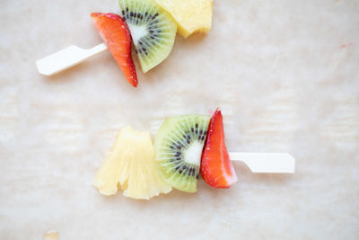 High angle view of chopped fruits on table