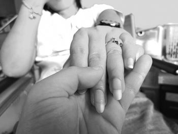 Close-up of couple holding hands
