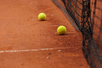 Tennis balls on playing field
