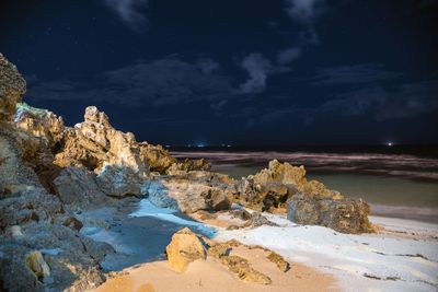 Scenic view of sea against sky at night