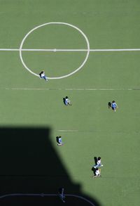 High angle view of people playing soccer on field