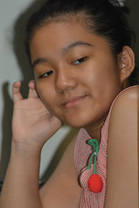 Close-up portrait of a smiling young woman