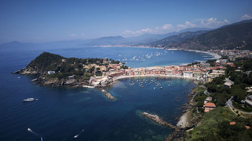 High angle view of sea and buildings against sky