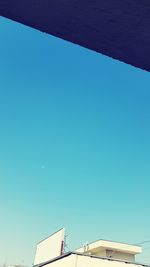 Low angle view of built structure against clear blue sky