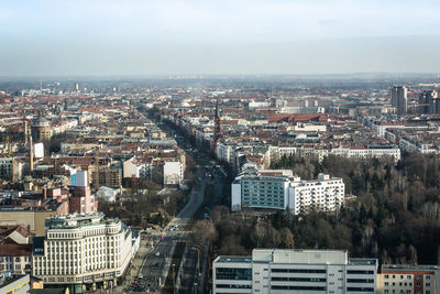 Aerial view of cityscape against sky