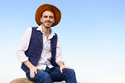 Close up portrait of handsome stylish casual man traveler