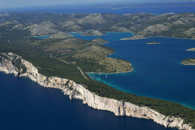 High angle view of bay against clear blue sky