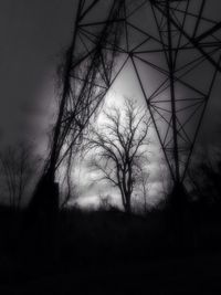 Low angle view of electricity pylon against sky