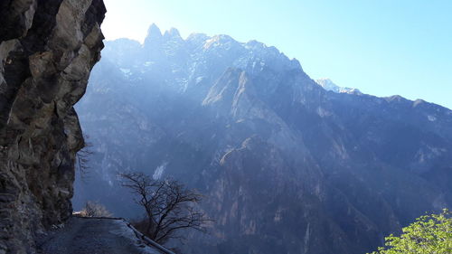 Scenic view of snowcapped mountains against clear sky