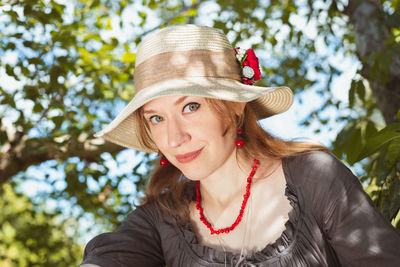 Close up playful woman with straw sun hat portrait picture