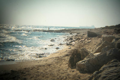 Scenic view of beach against clear sky