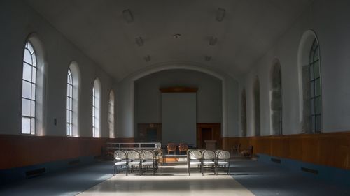 Rear view of chairs in empty interior