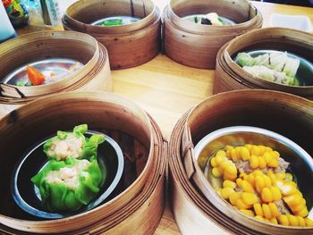 High angle view of food in bamboo steamers on table