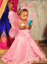 Cute baby girl holding indoors