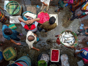 High angle view of people standing on street