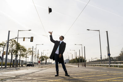 Full length of man standing against sky