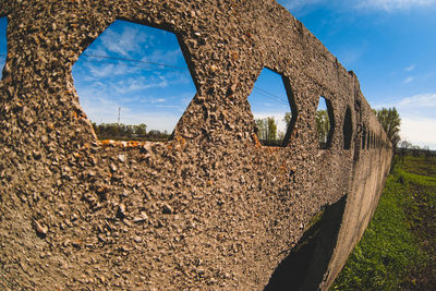 Old ruin on field against sky