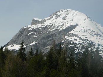 Scenic view of snowcapped mountains against clear sky